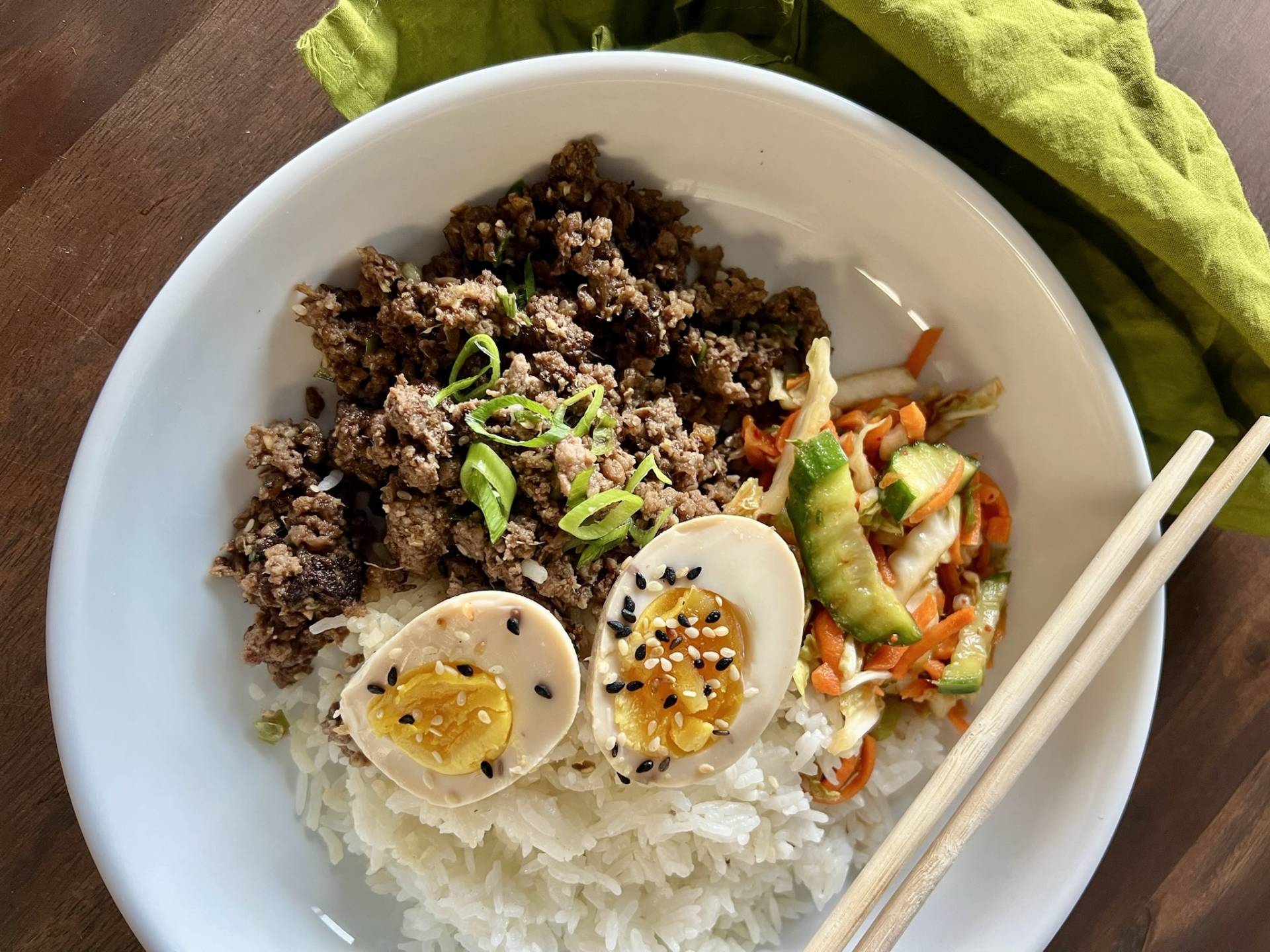 Beef Bibimbap Bowl with Quinoa, Soft Boiled Egg, and Kimchi Cucumber